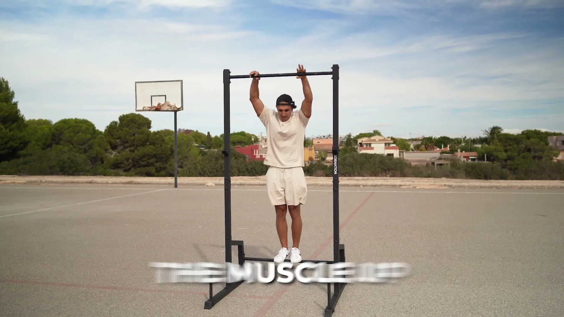 Daniel Flefil performing a muscle-up on the Gornation Pull Up Station with 50 kg added weight
