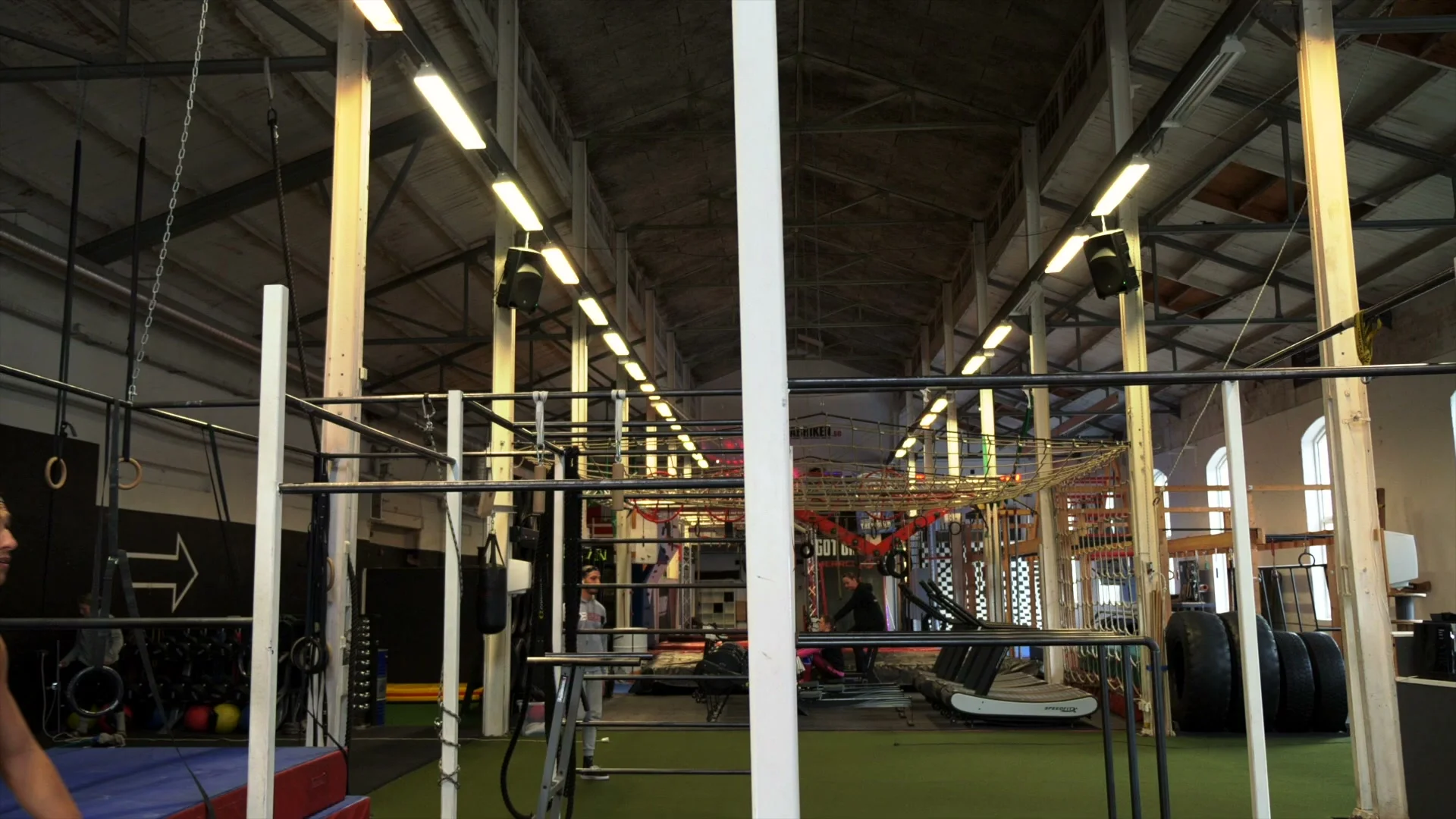 Swing setup for the V-sit muscle up: controlled bar swing with full range of motion, feet reaching bar height