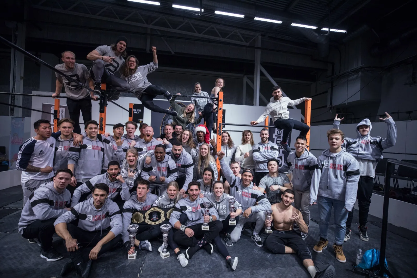Group photo at Beast of the Barz calisthenics competition with athletes holding trophies